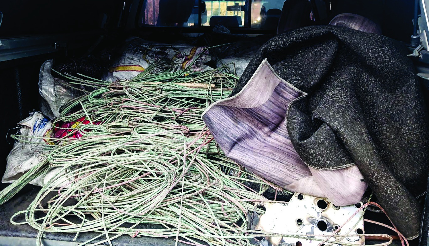 Bags and loose pieces of suspected stolen copper cable found on the back of one of the seized vehicles.
