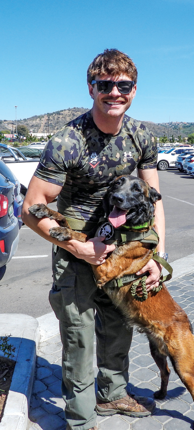 READY FOR ACTION | HenCor Tactical Solutions general manager Jan-Hendrik Holsthyzen with Magnus, one of the organisation’s trained tactical dogs.